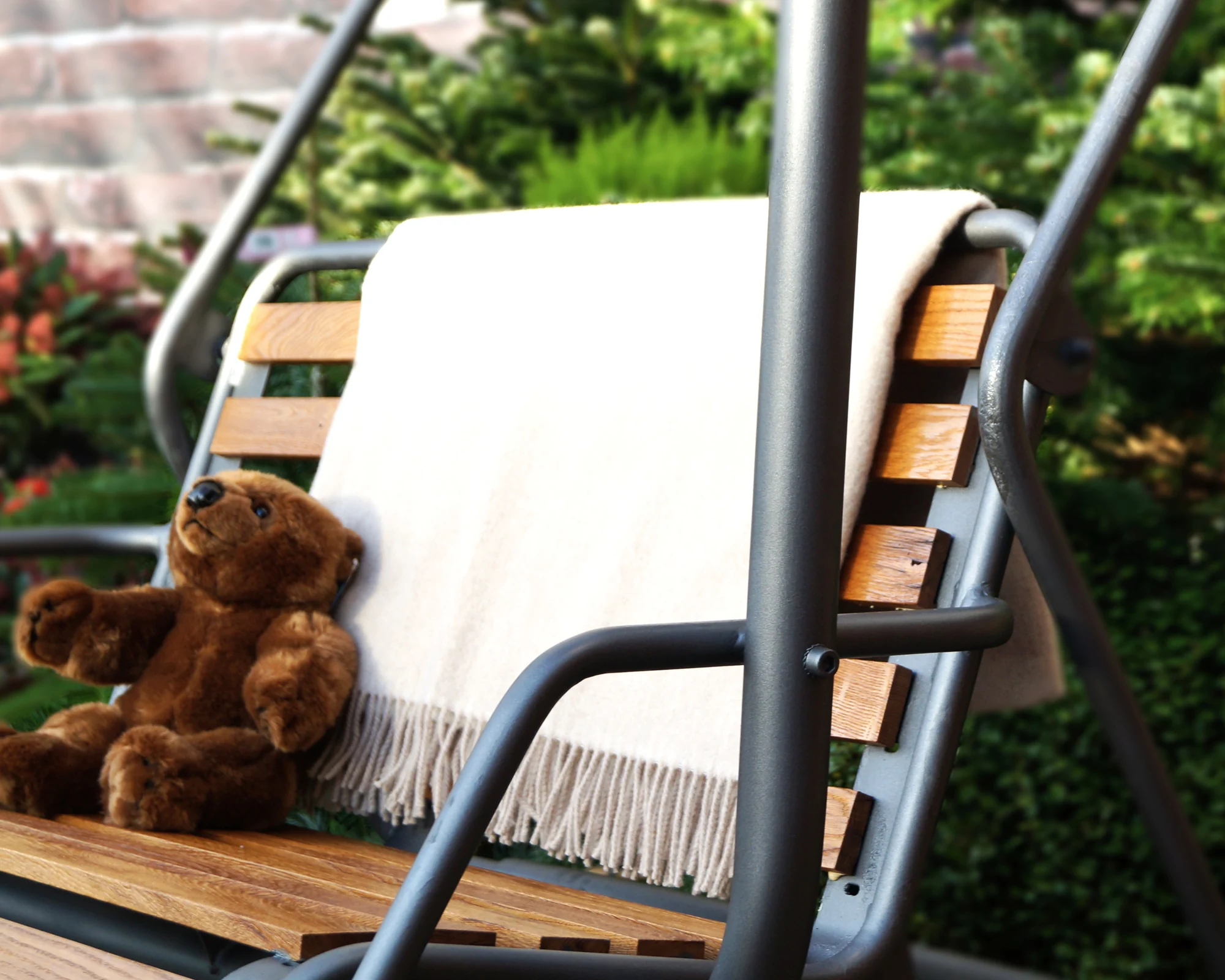 Hand-stitched bear with wicker travel basket — alpine craftsmanship